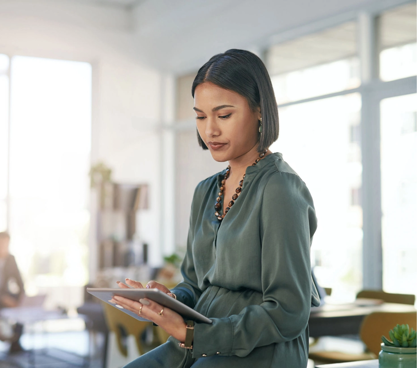 Businesswoman working on digital device