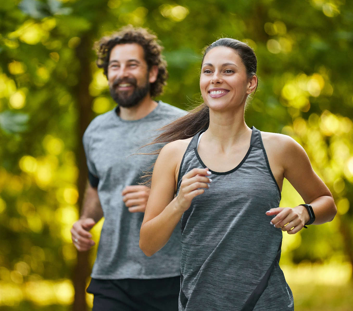 Smiling runners exercising outdoors